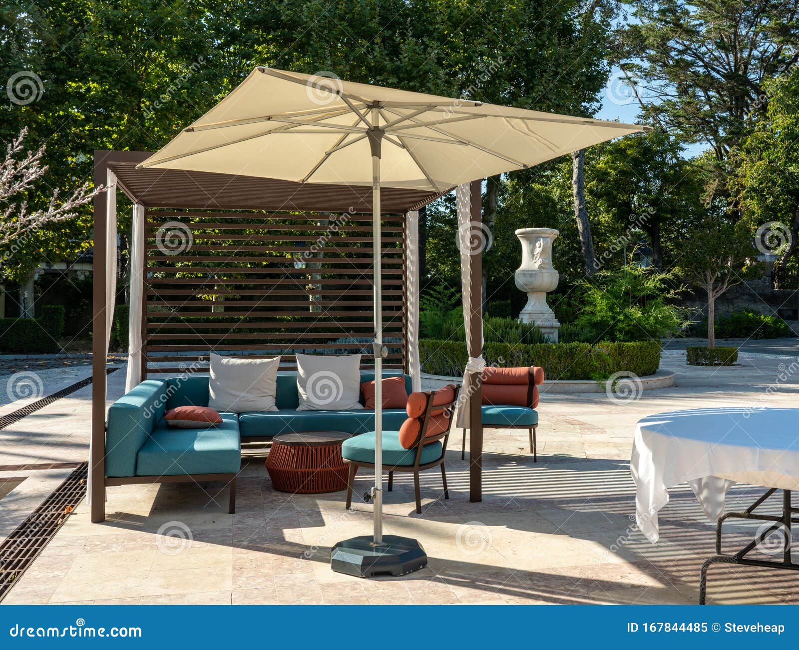 Outdoor Lounging Chairs And Seats On Patio In Garden Stock Image Image Of Luxury Parasol 167844485