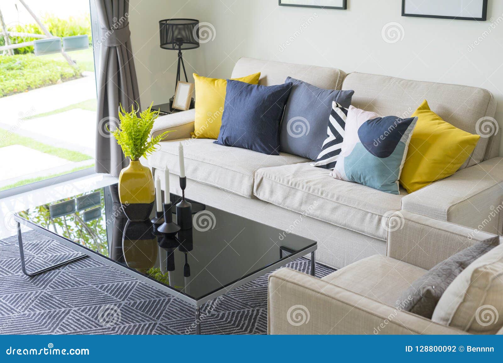 Modern Pattern Blue And Yellow Cushion On Grey Sofa Stock