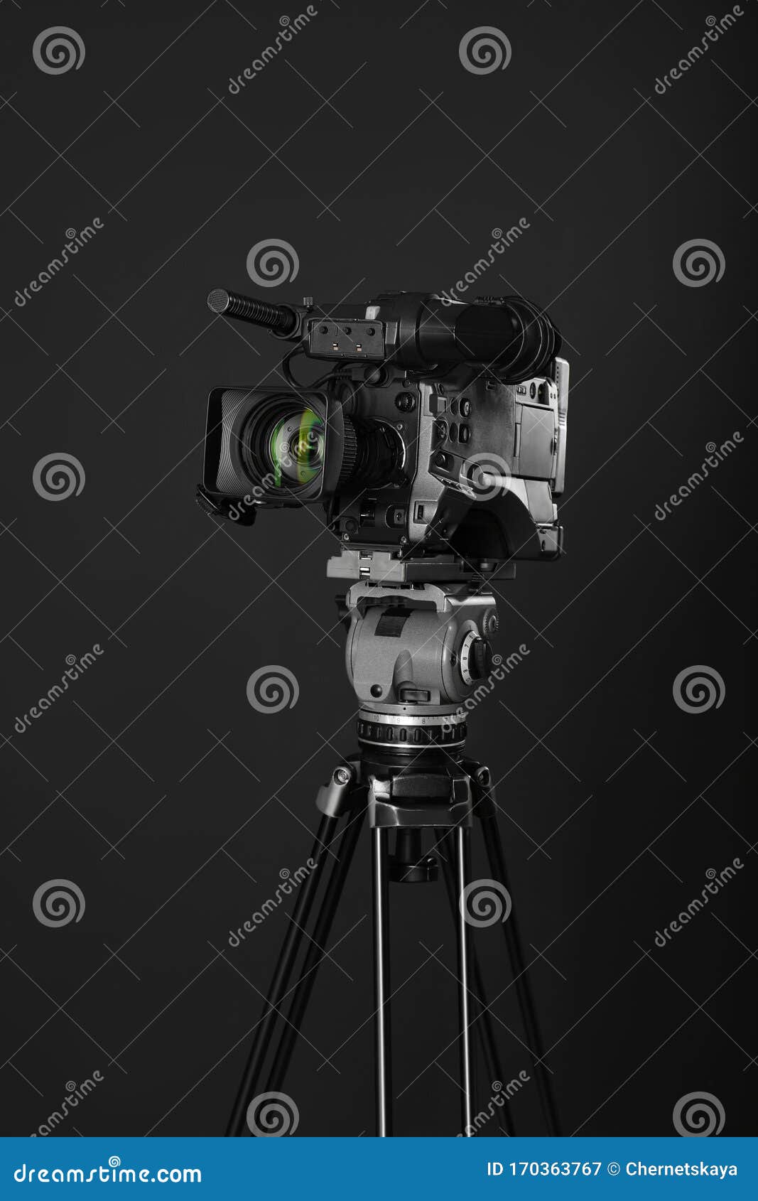 Modern Professional Video Camera on Black Background Stock Image