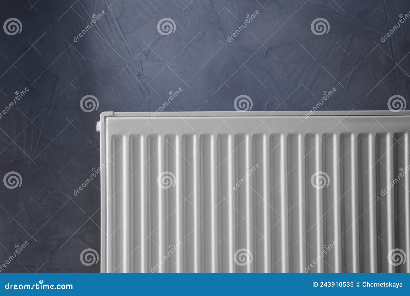 Modern Radiator on Grey Wall. Central Heating System Stock Image