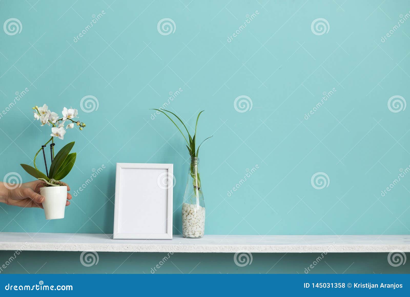 Download Modern Room Decoration With Picture Frame Mockup. White Shelf Against Pastel Turquoise Wall With ...
