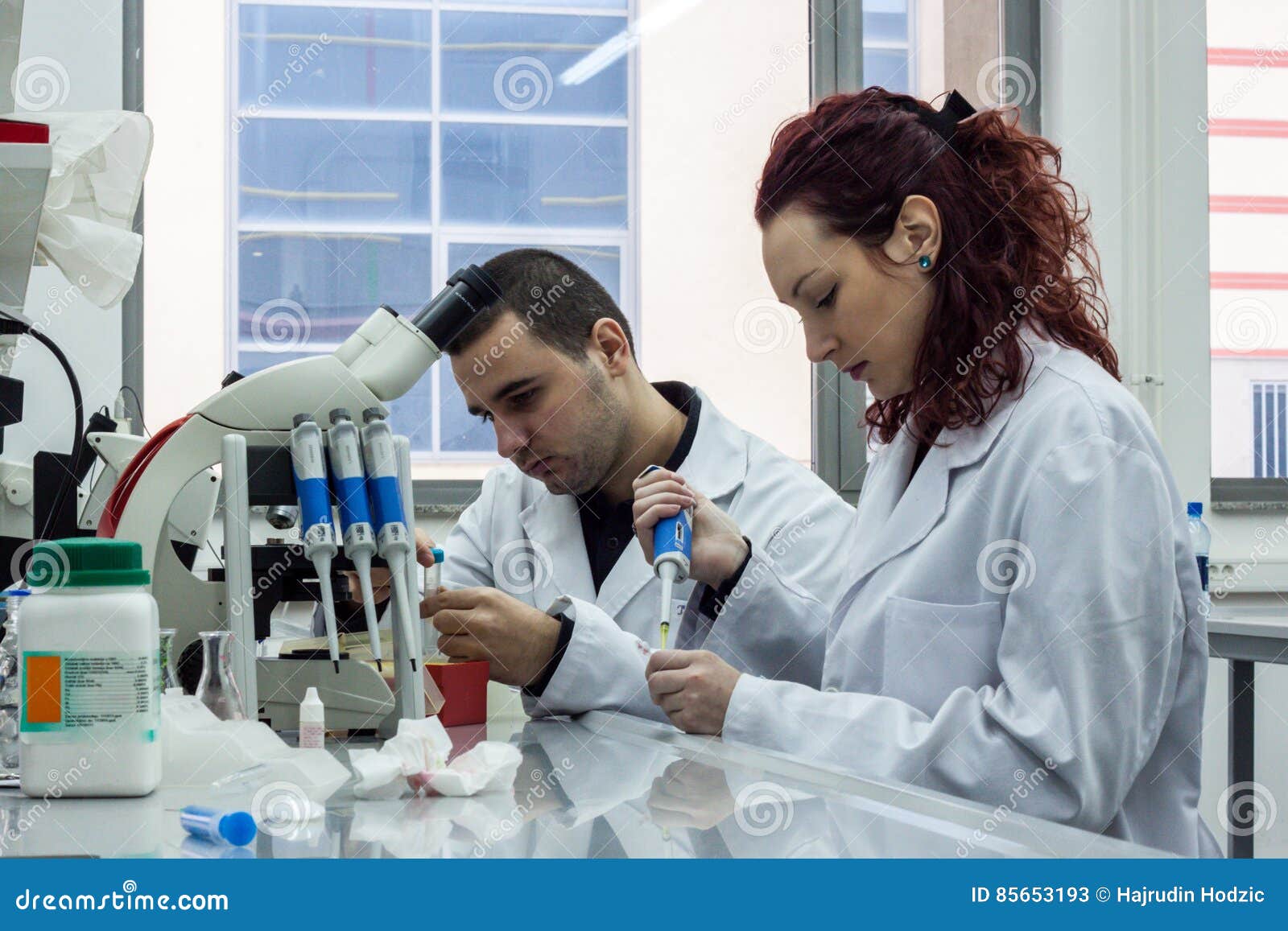 Modern Scientist Working with Pipette in Biotechnology Laboratory