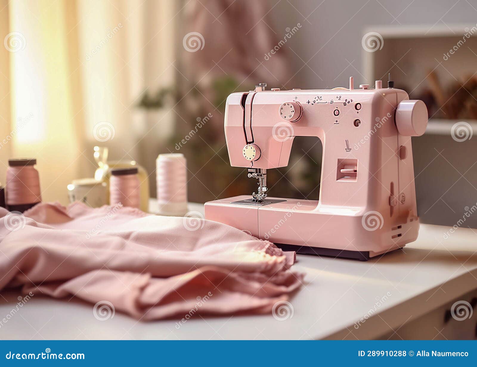 Modern Sewing Machine, Cloth and Threads on the Table Stock