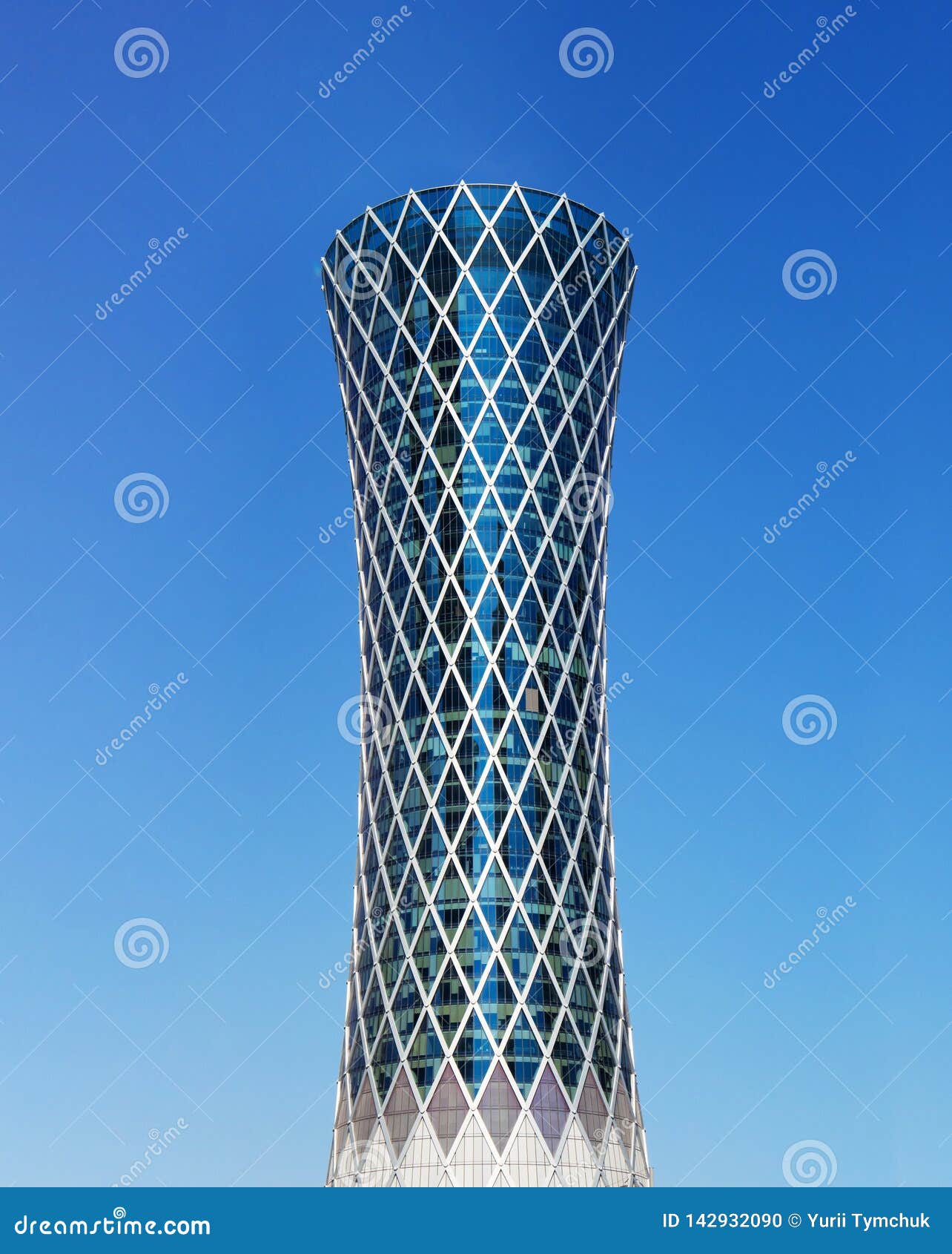Modern Skyscraper Tornado Tower in Qatar on Blue Background Stock Photo