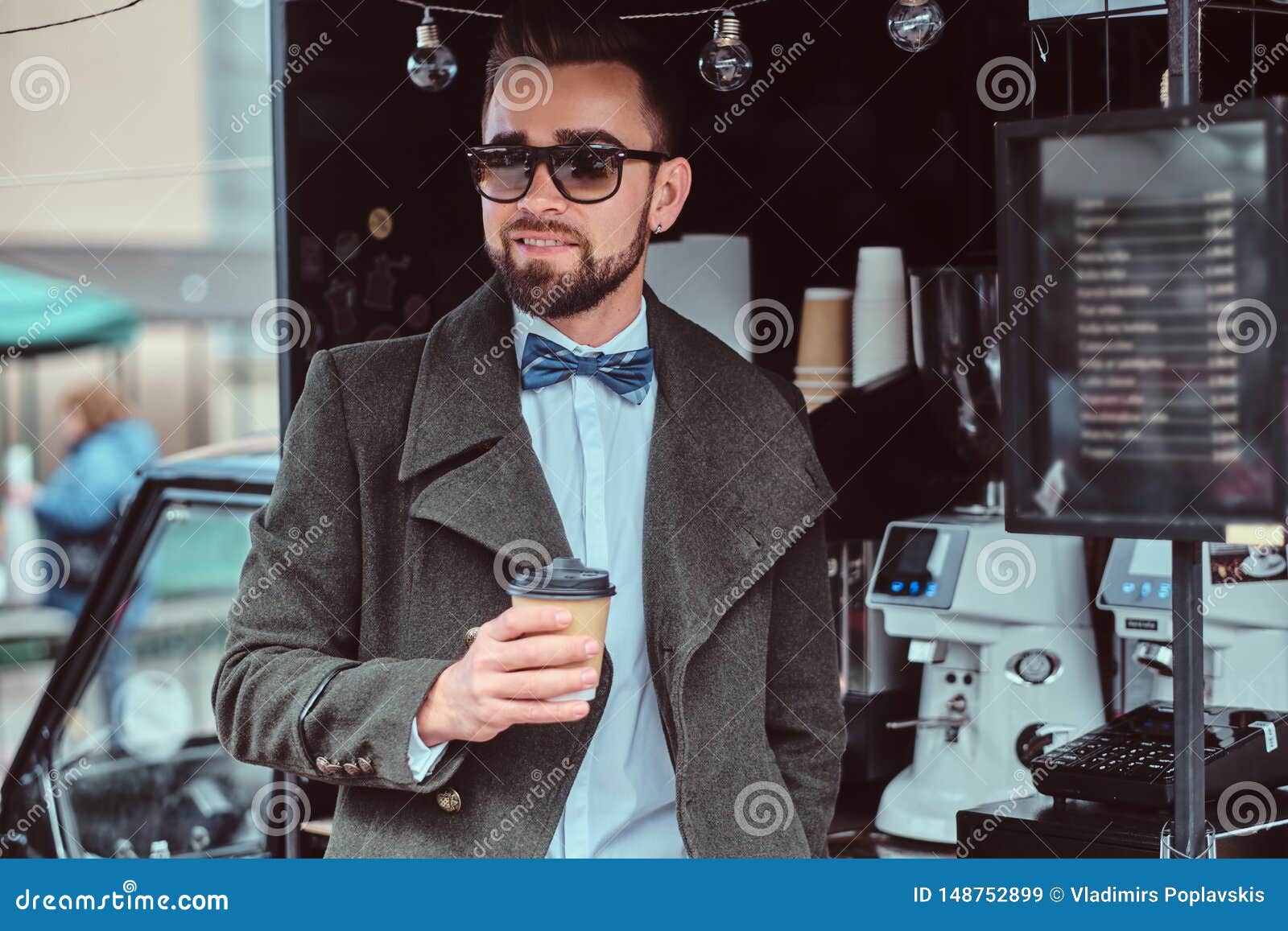 Modern Smiling Man in Sunglasses is Drinking Coffee while Standing ...