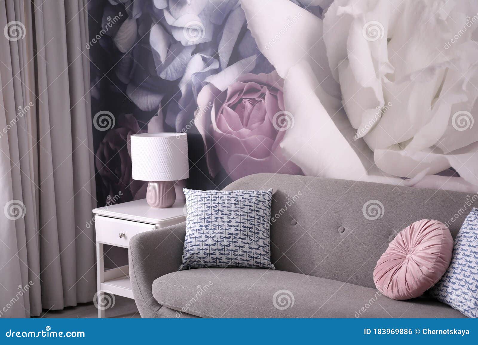 Sofa Near Wall With Floral Wallpaper. Stylish Living Room