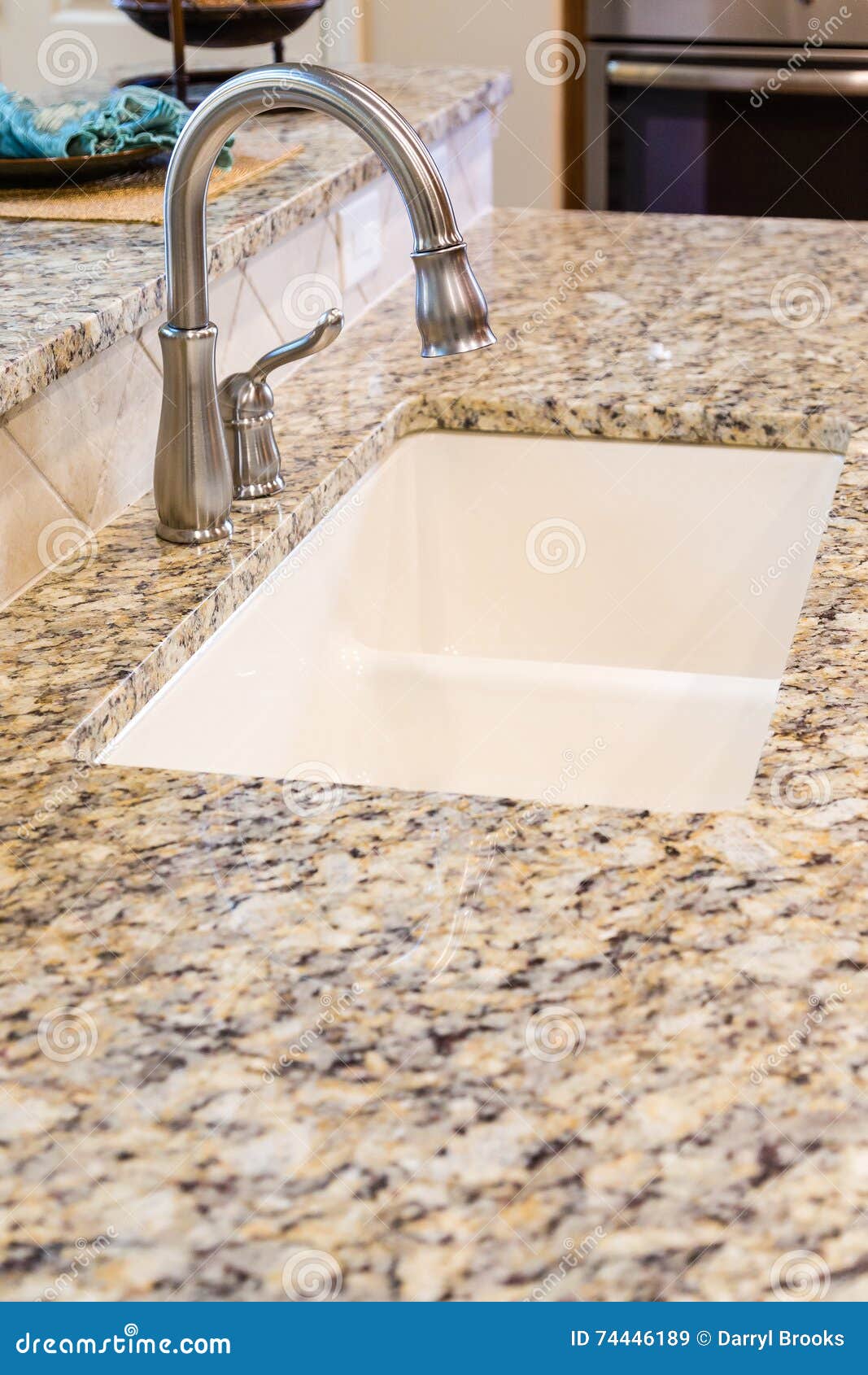 Modern Stainless Steel Faucet On Granite Kitchen Counter Stock