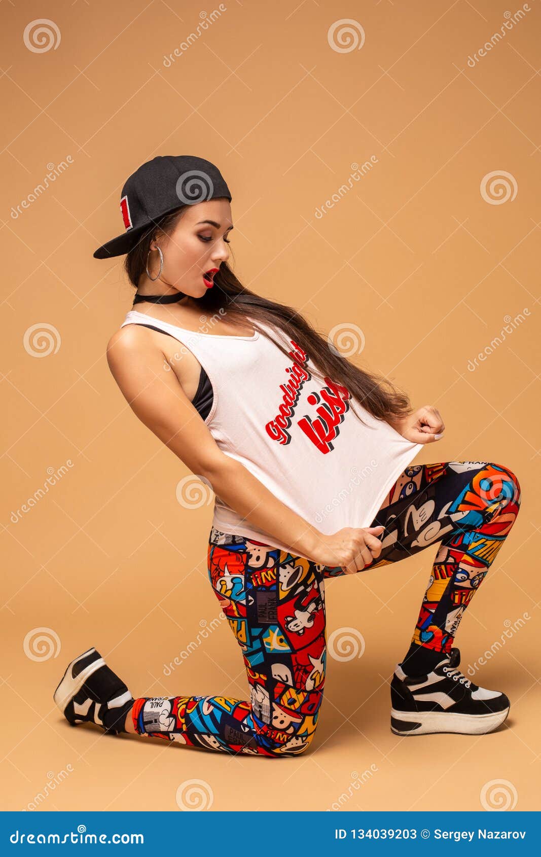 modern style dancer posing on studio background. hip hop, jazz funk, dancehall