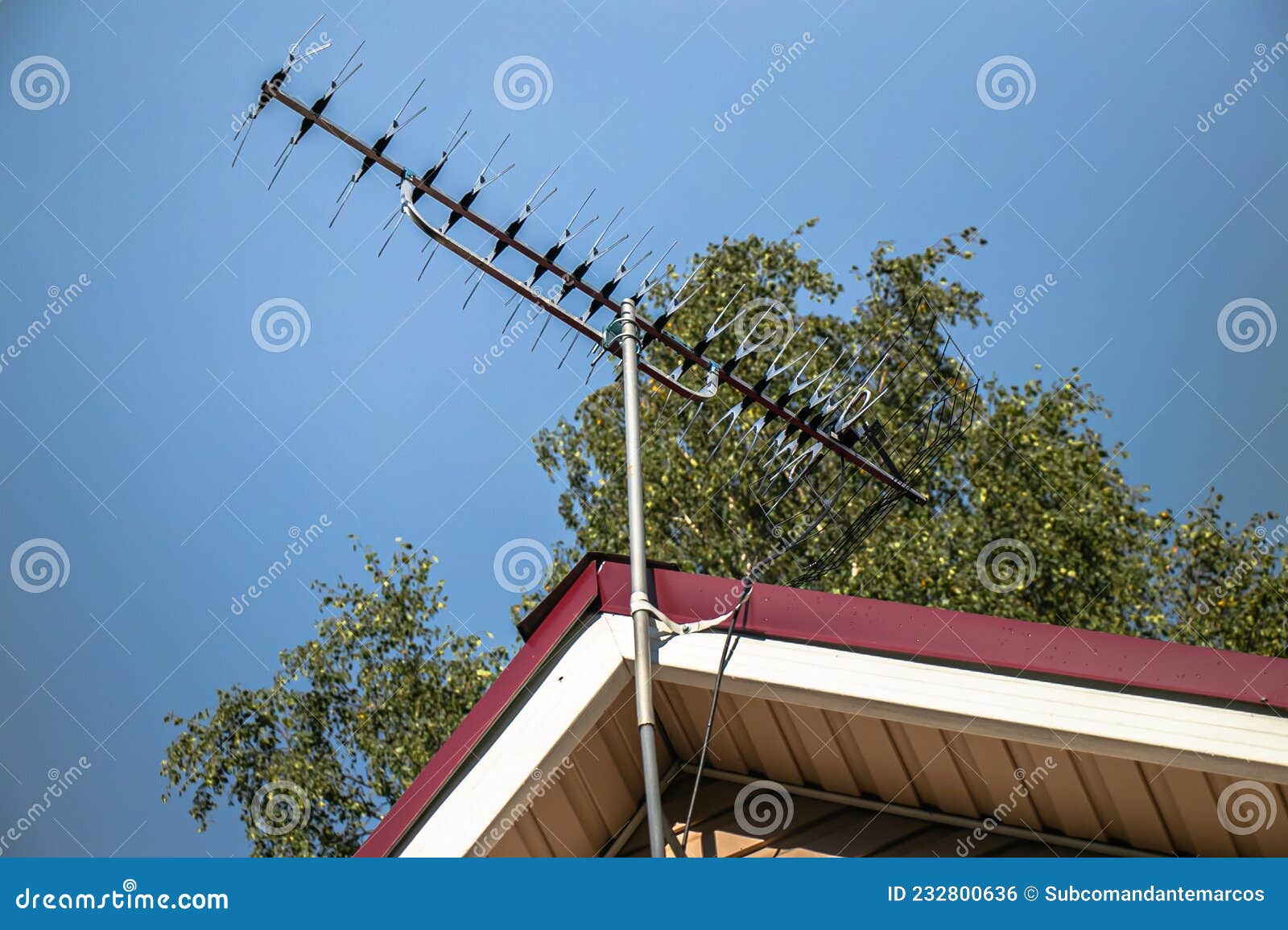 Telecommunication Technologies.Television Metal Antenna with Blue Sky Background. Analog Television Antenna on Roof. Antenn Stock - Image of metal, home: 232800636