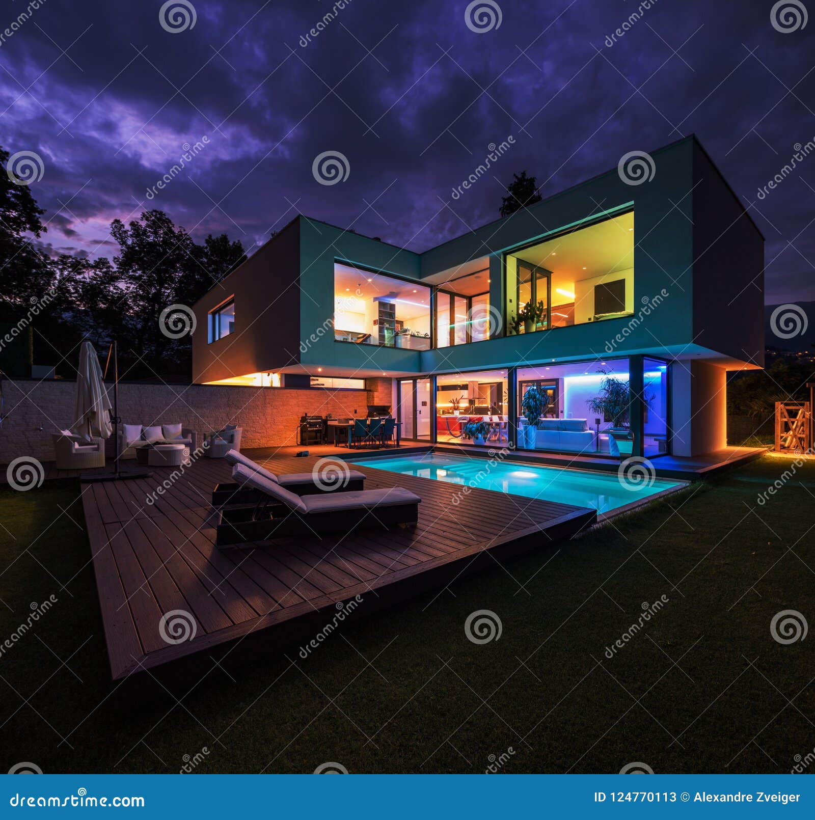 modern villa with colored led lights at night