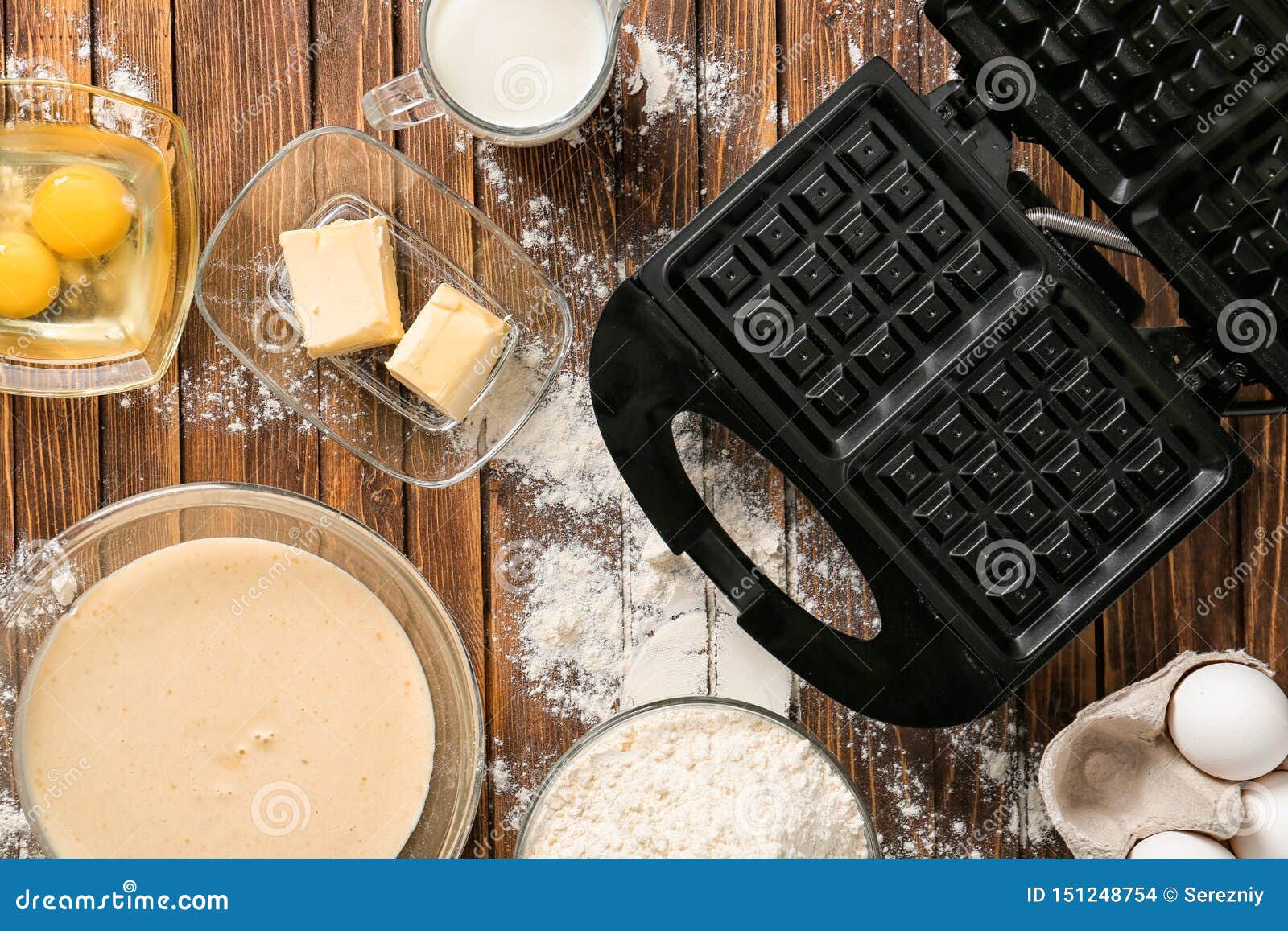 Modern Waffle Maker with Ingredients on Wooden Table Stock Photo