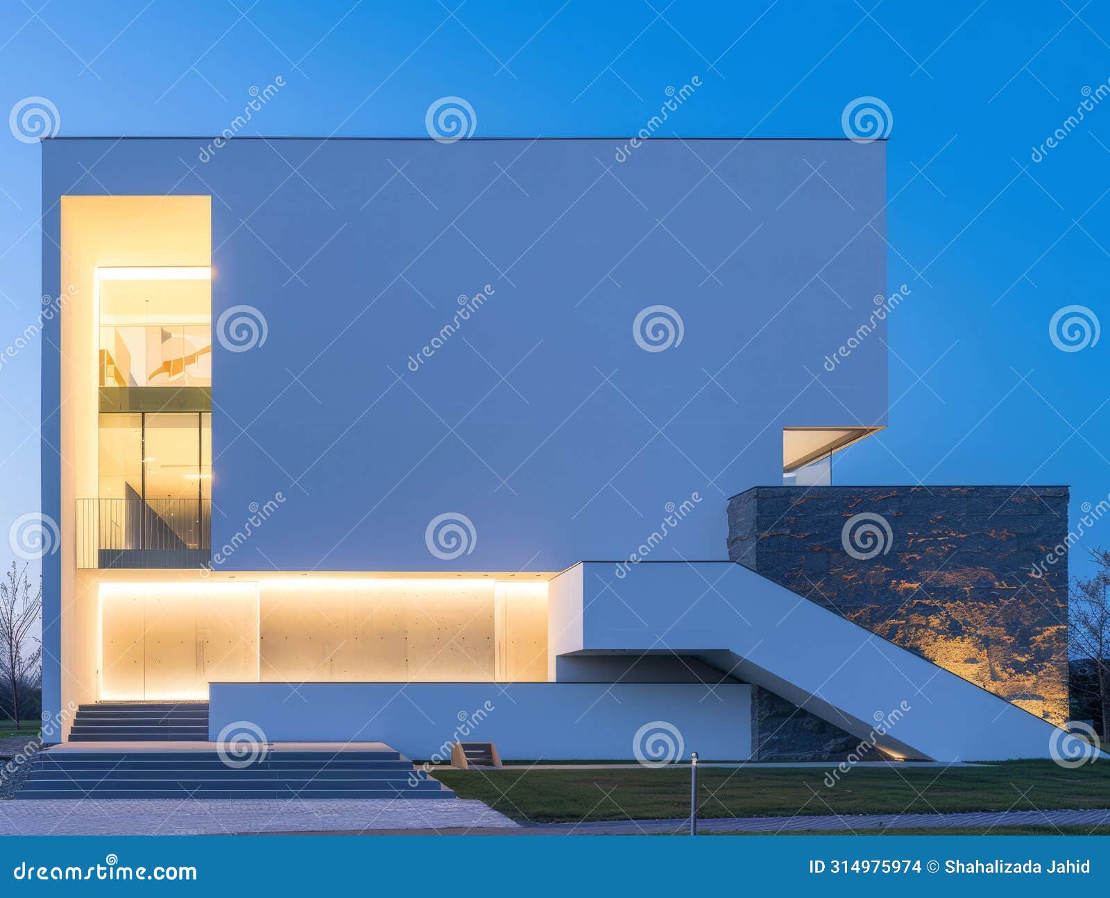 A Modern White House with a Blue Sky in the Background is Lit Up at