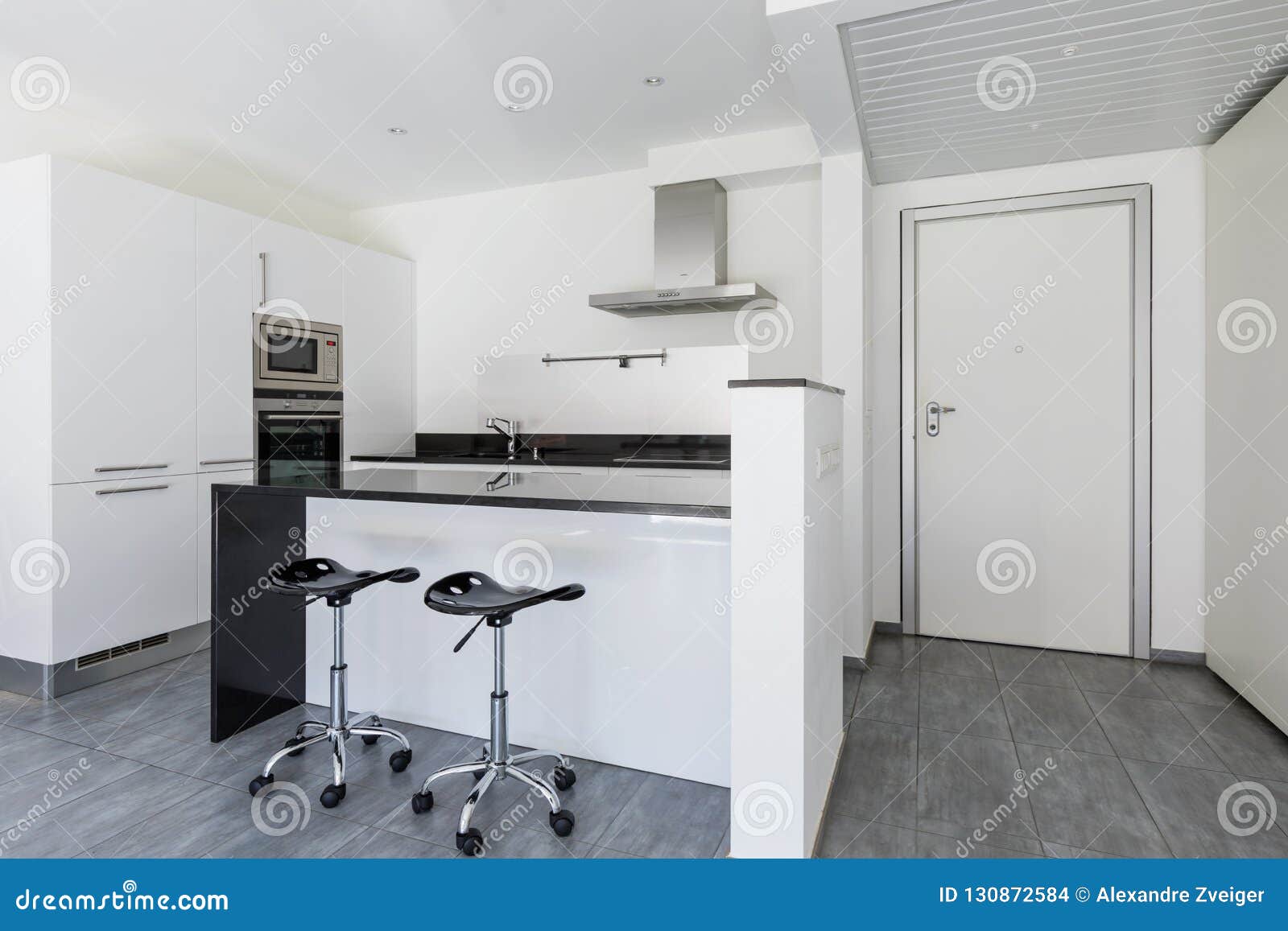 Modern White Kitchen with Island and Stools Stock Photo Image of