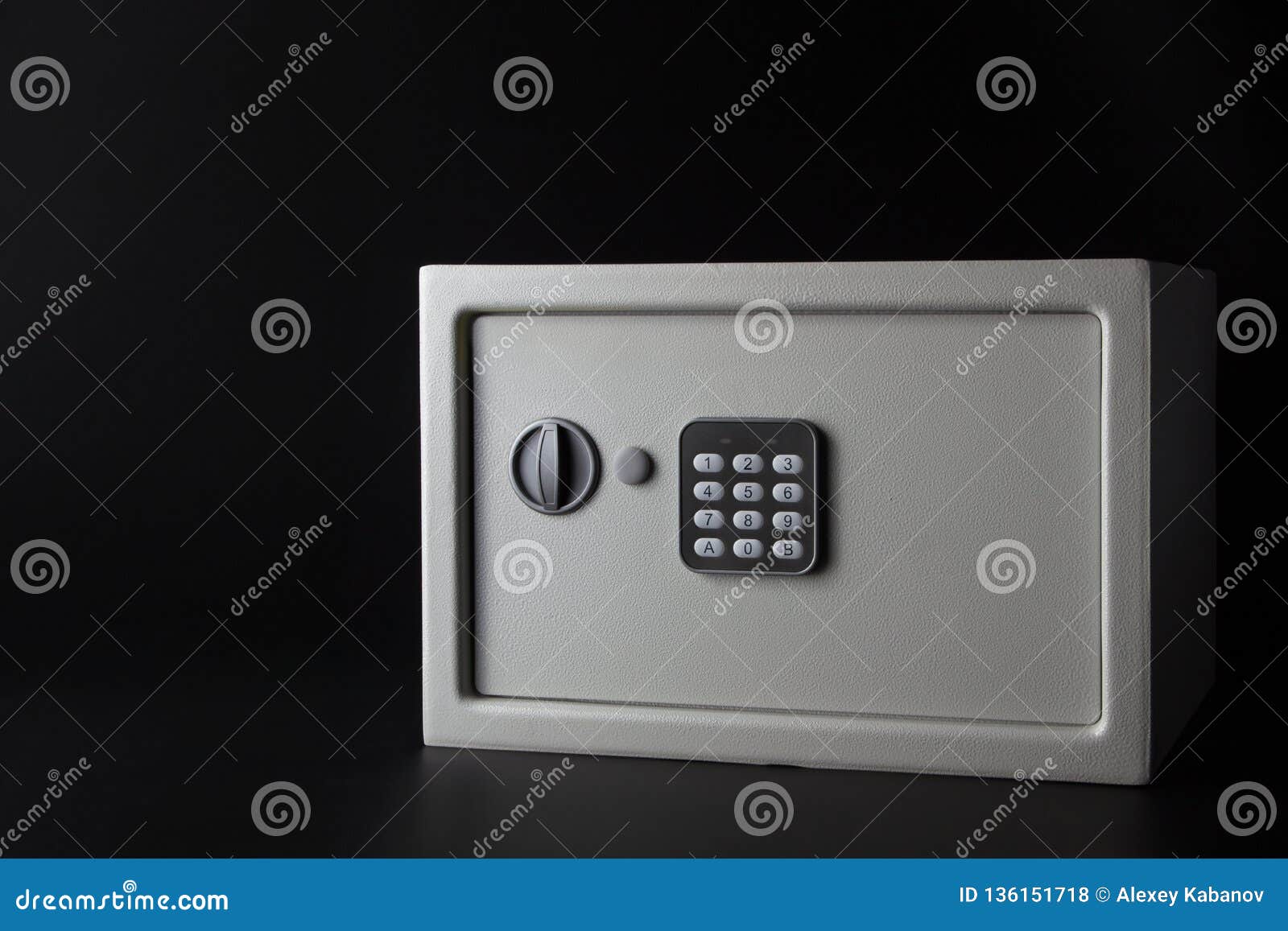 modern white steel money bank safe on a dark background with a coded lock.