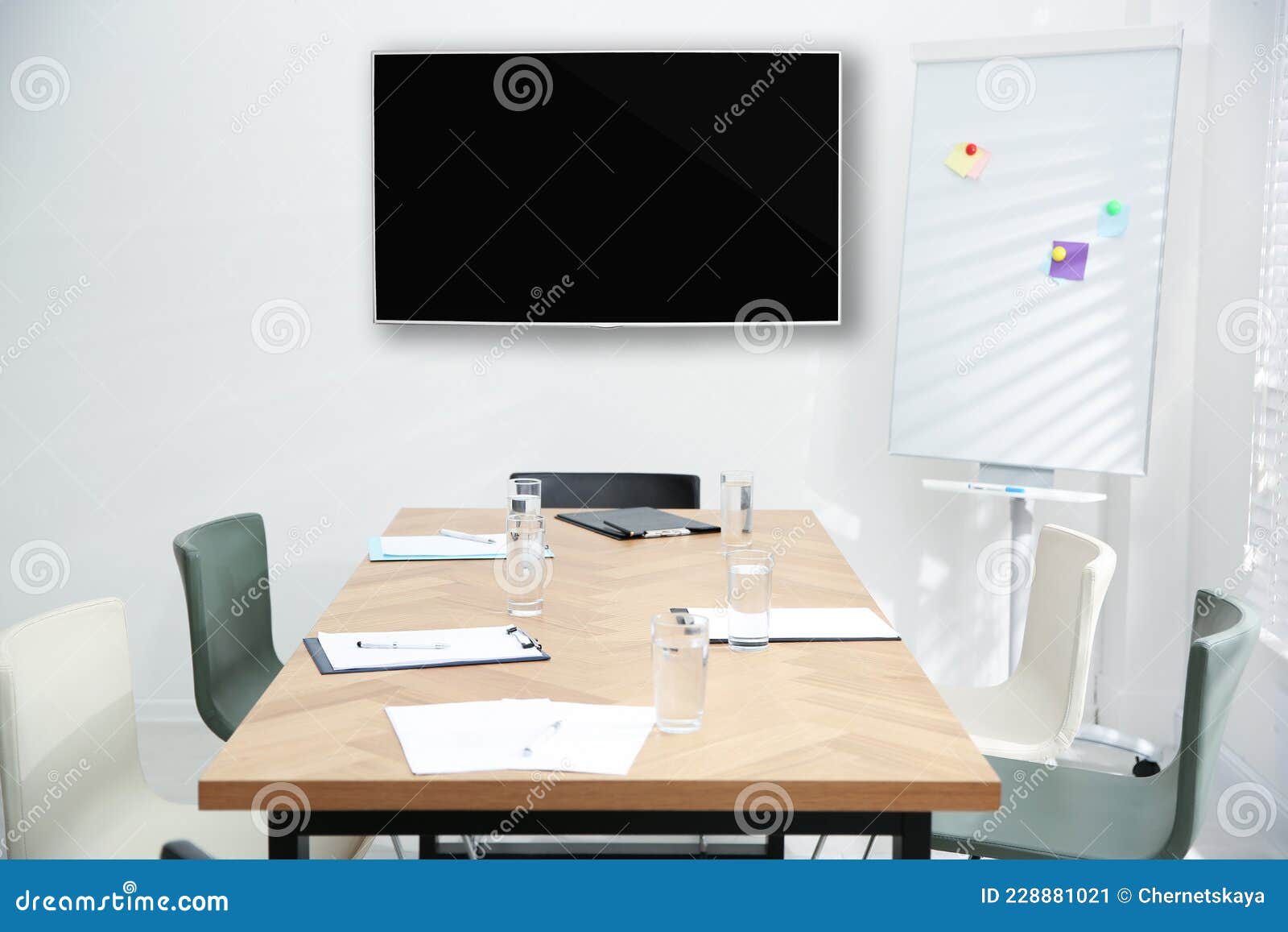 Modern Wide Screen TV on White Wall in Conference Room Stock Image