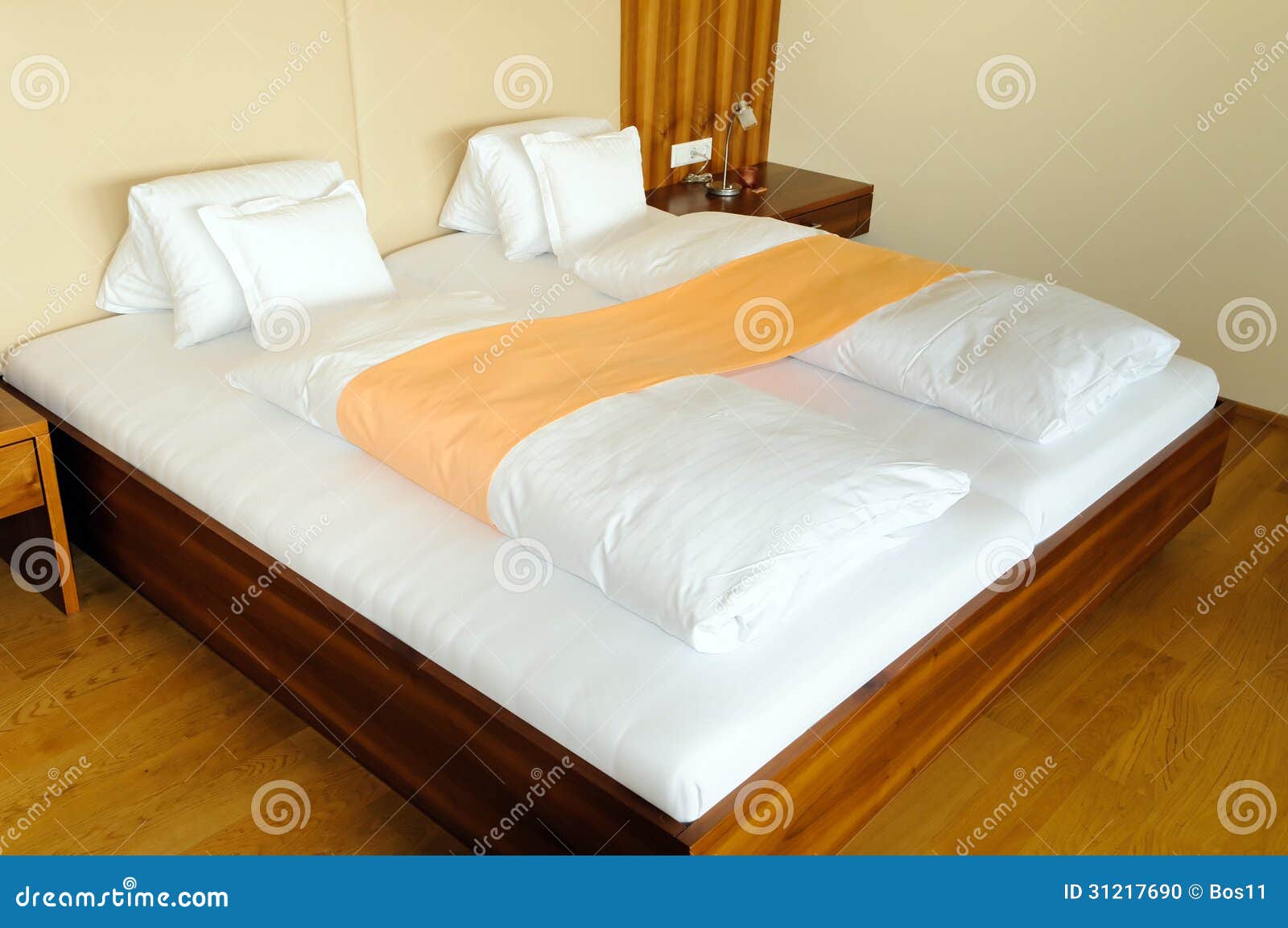 Modern wooden bed in hotel stock photo. Image of luxury 31217690