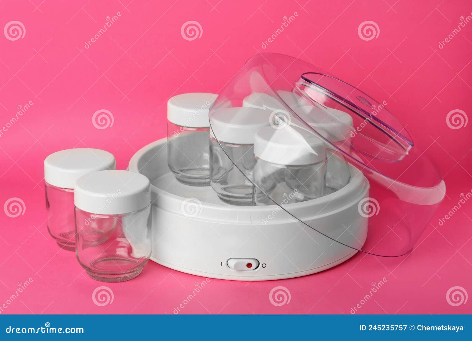 Modern Yogurt Maker with Empty Jars on Pink Background Stock Image