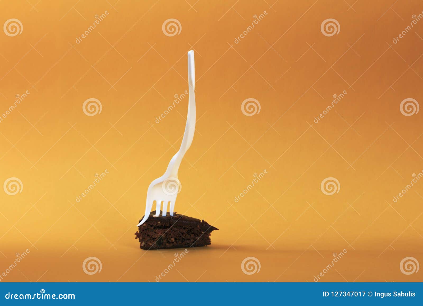 a modified single-use fork inserted into the cake.