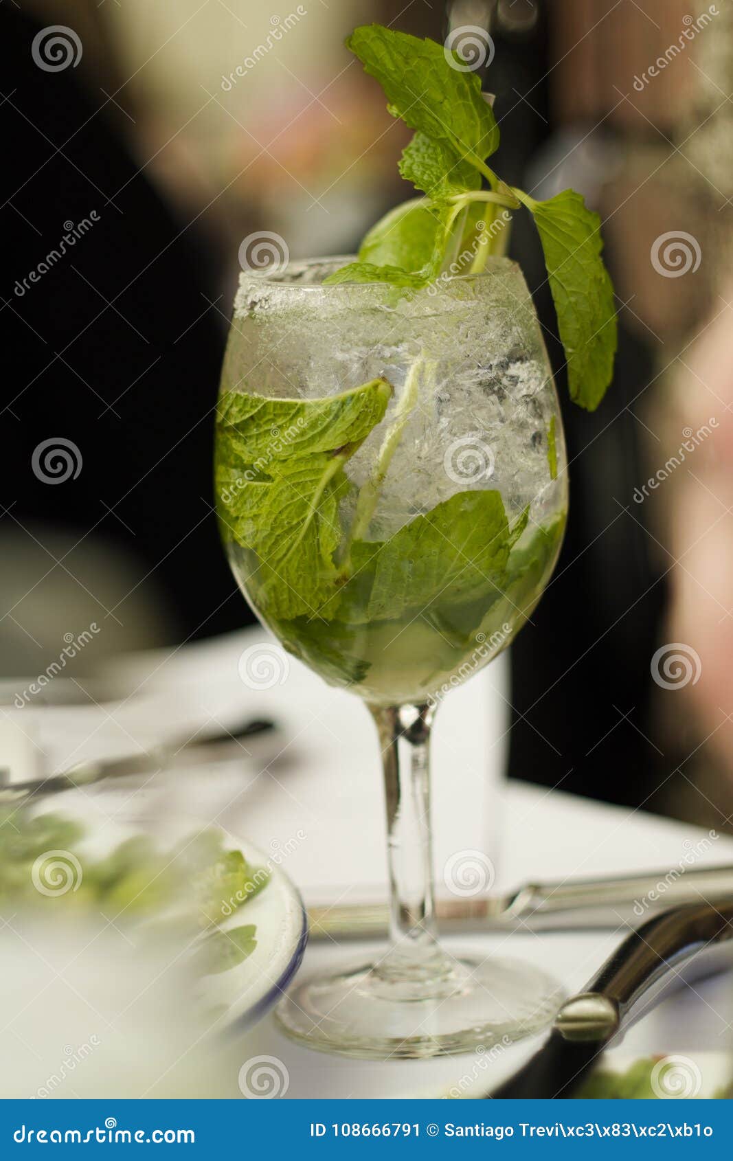 mojito cubano or caipirinha cocktail, iced drink with lime and mint