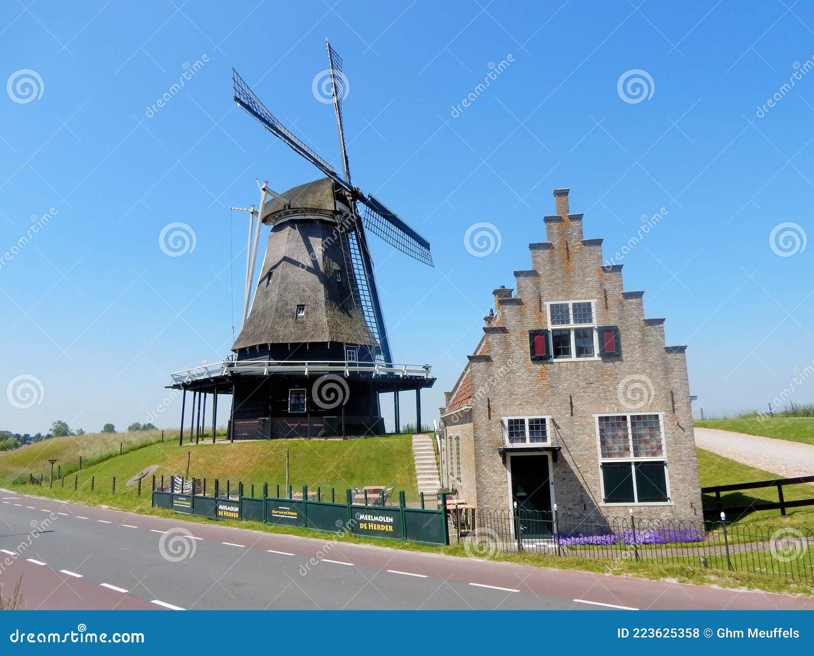 molen de herder, dutch windmill the shepherd, tower mill located in medemblik, north holland, netherlands