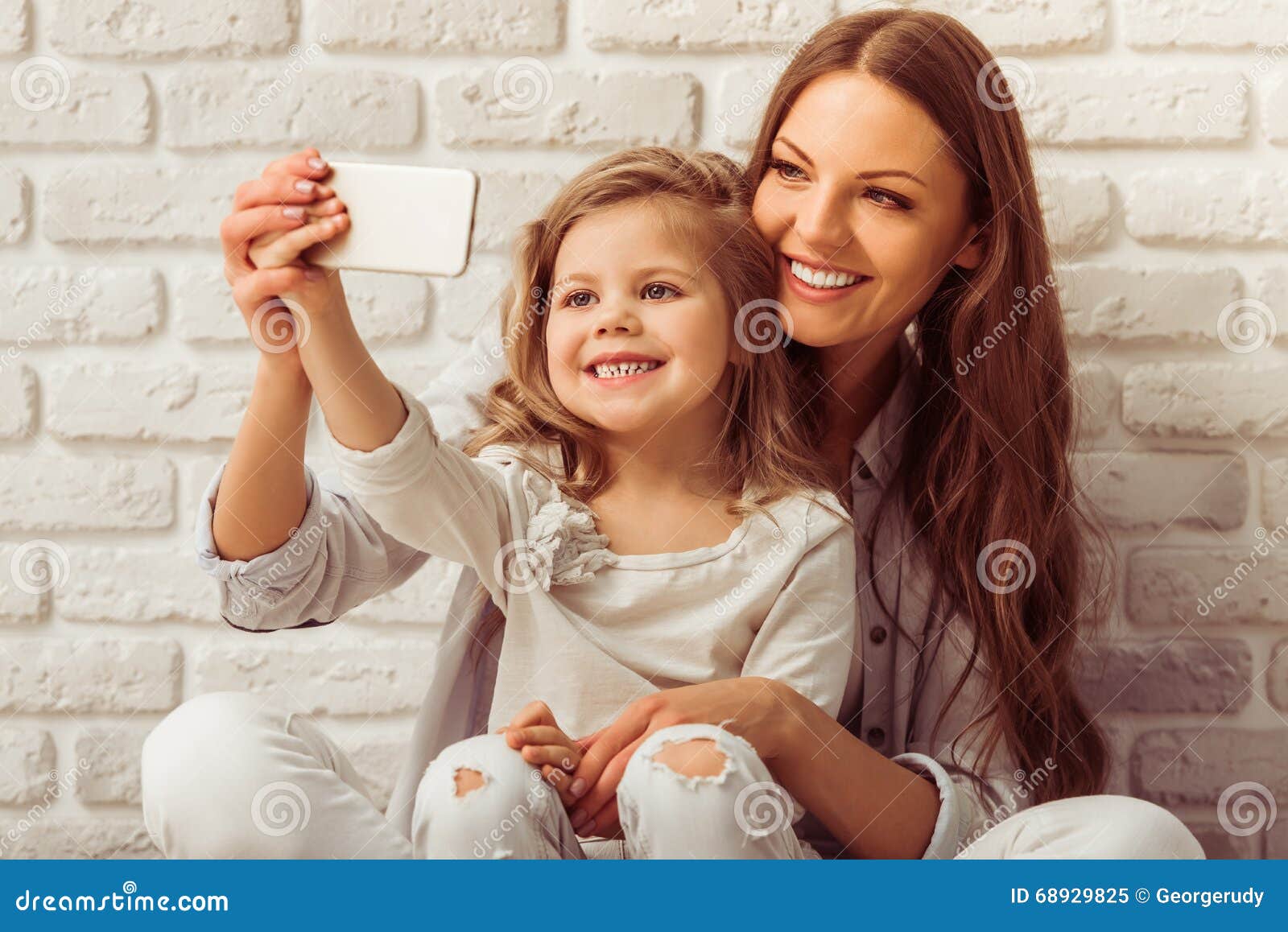 Mom, daughter and gadget stock image. Image of lifestyle - 68929825