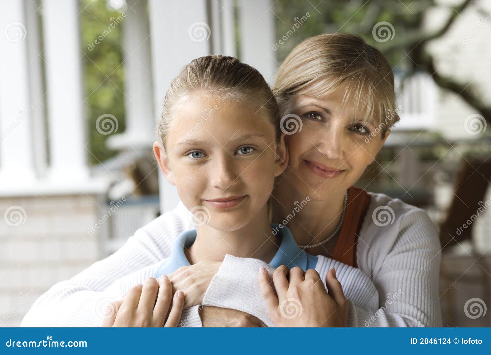 Mom and daughter hugging. stock photo. Image of holding - 2046124