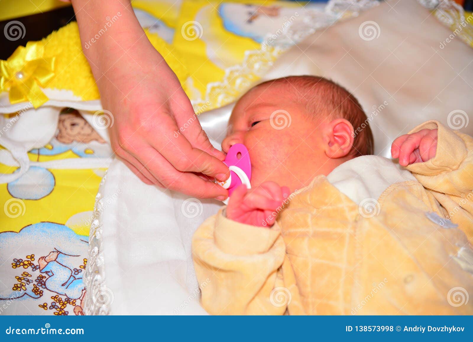 giving a newborn a pacifier
