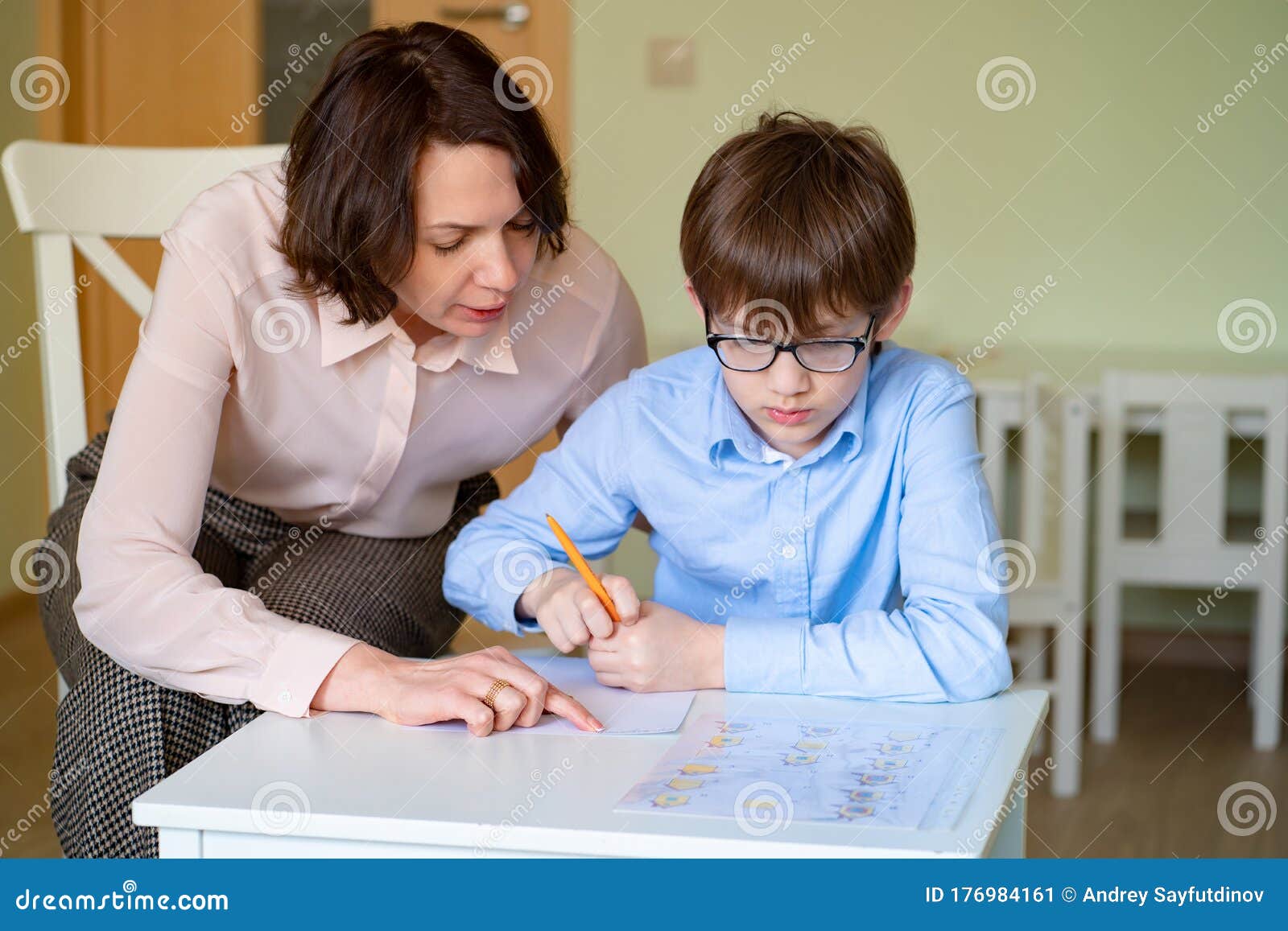 Mom Helps Son To Do Homework Teacher Deals Boy Stock Image