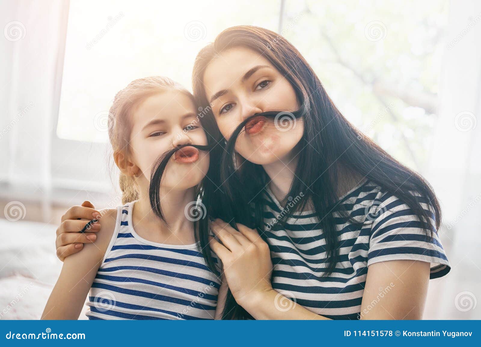 mom and her daughter are playing