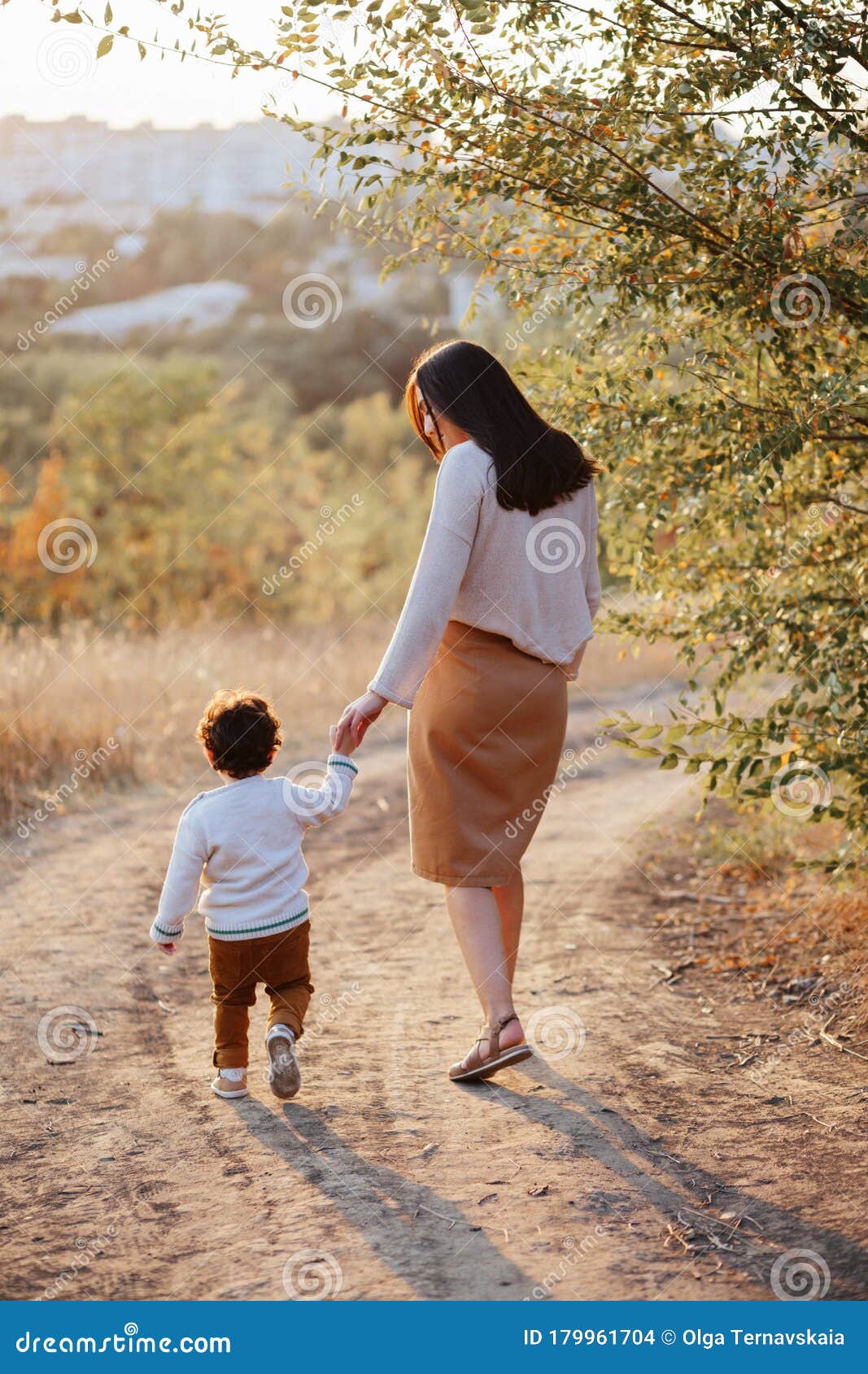 Mom And Her Little Son 2 Years Old On Walk In The Autumn Park Holding Hands Motherhood Mothers