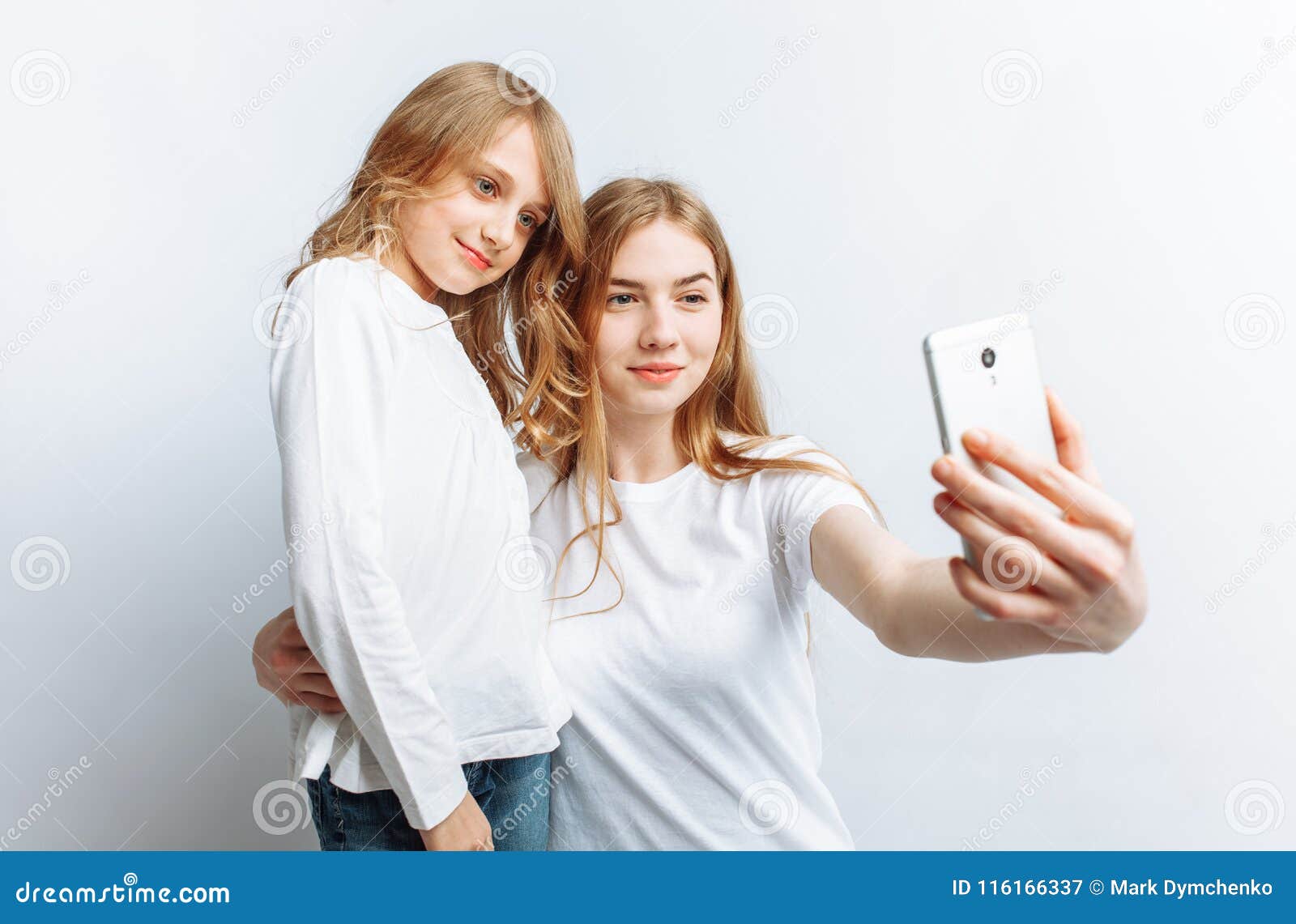 Mom or Older Sister Makes Selfie Little Girl, Happy Family, Photo ...