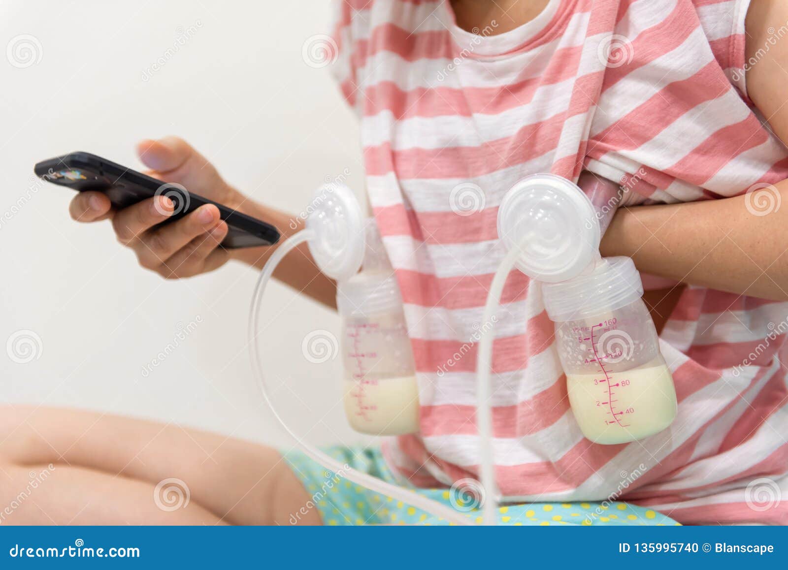 Mom Pump Milk And Play Smartphone Stock Photo Image Of Container