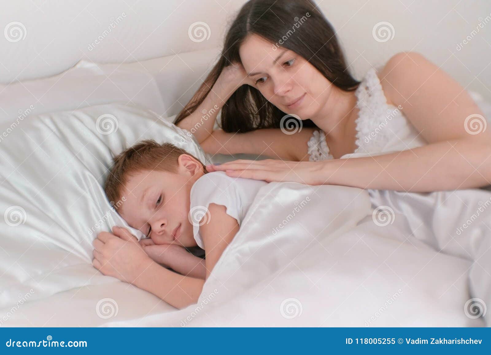 Mom Puts Her Son To Bed Stroking His Back Stock Image Image Of