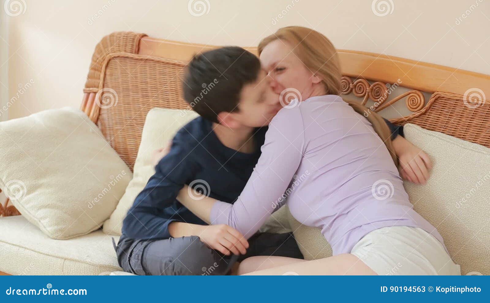 Mom and Son Chatting Heart To Heart on the Wicker Sofa Stock Video