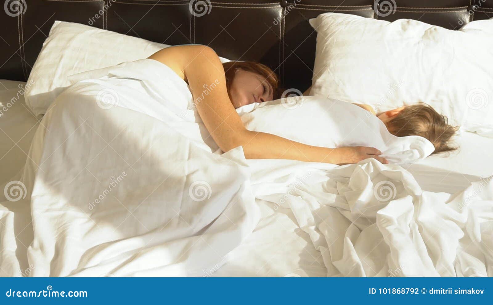 Mom and Son Sleep in the Morning in Bed at Stock Footage picture