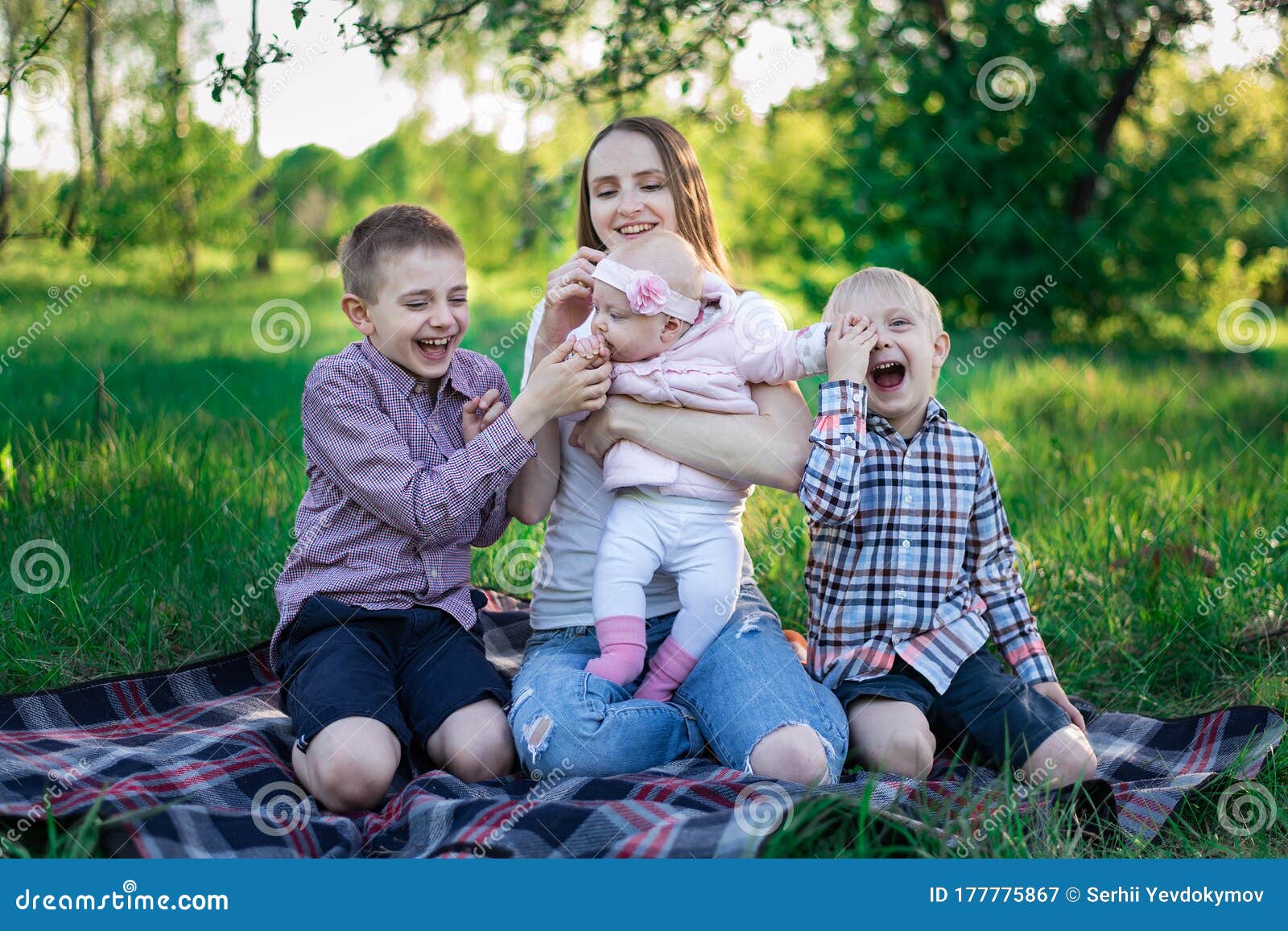 Mom With Two Sons And Little Daughter At Picnic Three Ch