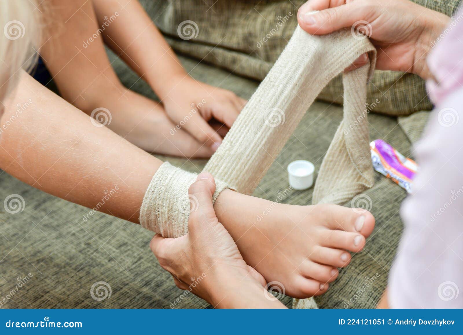 Mom Will Bandage the Wound on Her Little Child`s Leg Stock Image