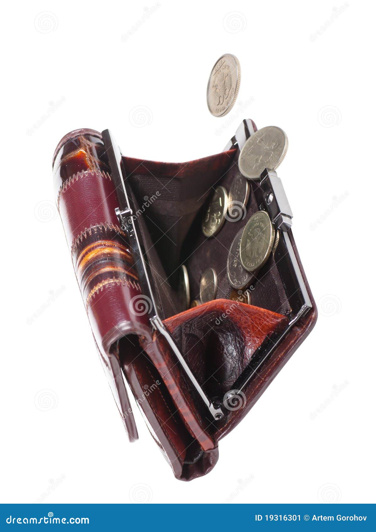 Money. Coins falling into a female purse isolated over white background