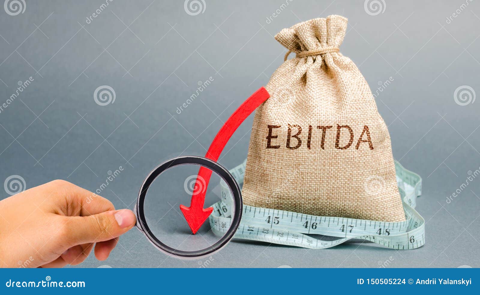 money bag with the word ebitda and down arrow. earnings before interest, taxes, depreciation and amortization. problems with