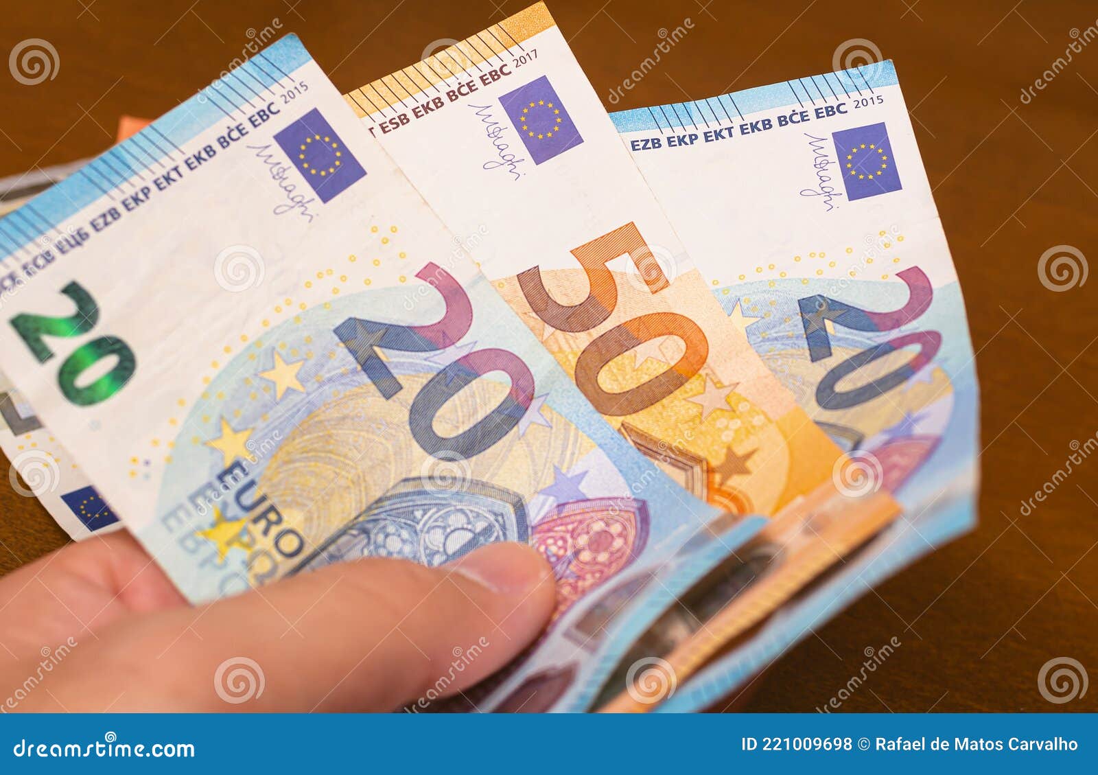 Money, EURO - EUR. a Man Holding Euros Banknotes in His Hands Stock Photo -  Image of close, closeup: 221009698