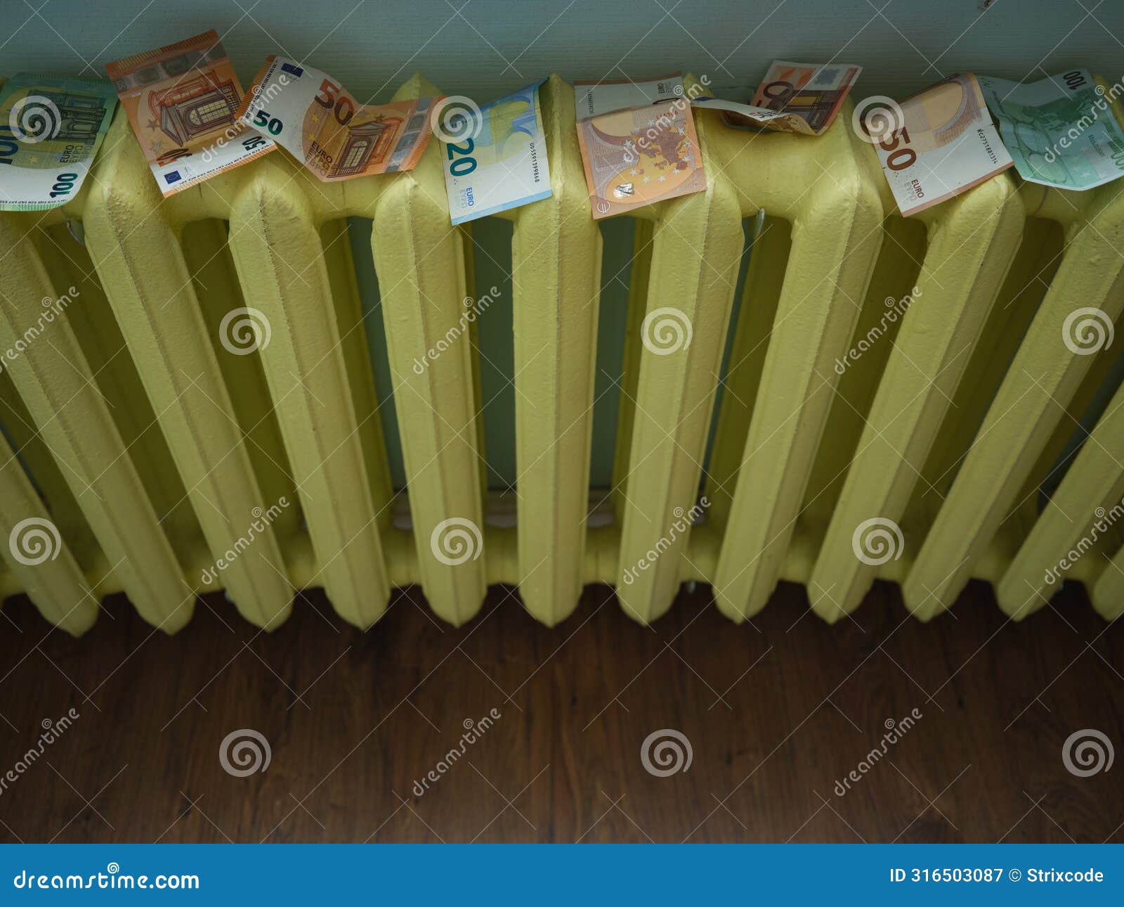 money laundering concept image with copyspace. euro banknotes drying on yellow radiator