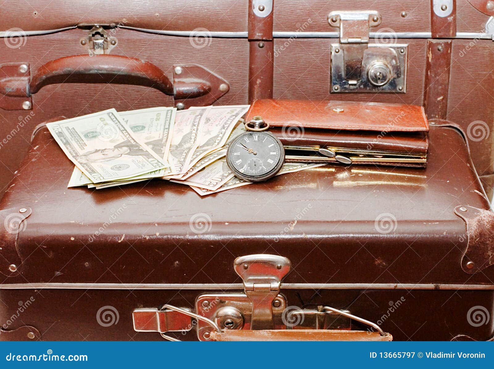 money lays on an old suitcase