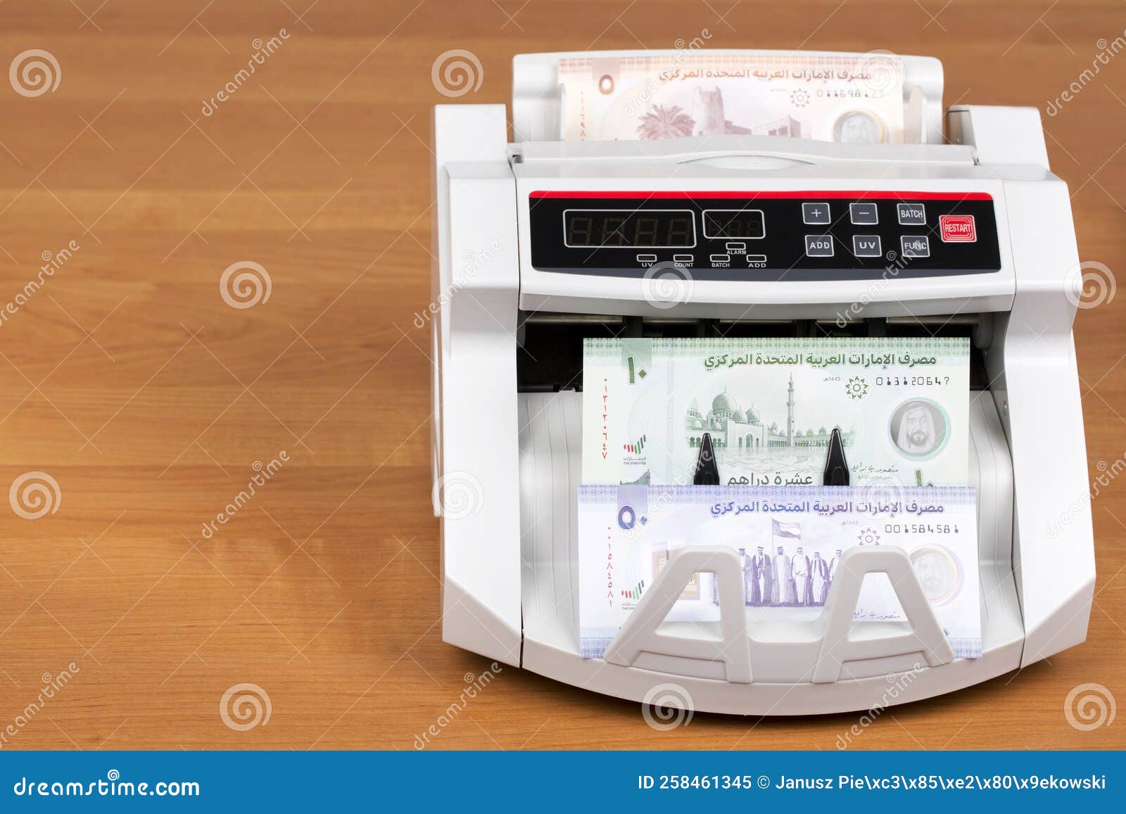 Money from the United Arab Emirates in the Counting Machine Stock Image