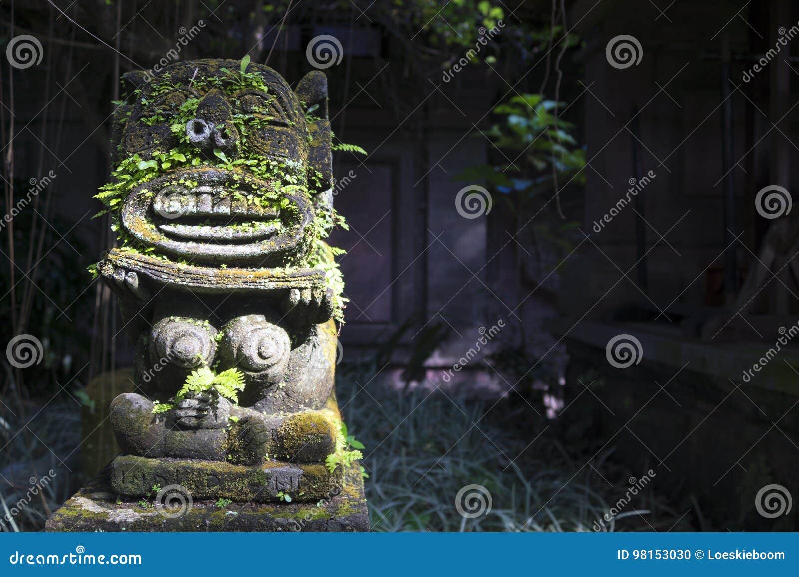 monkey spirit sculpture in arma museum on the left, ubud, bali, indonesia