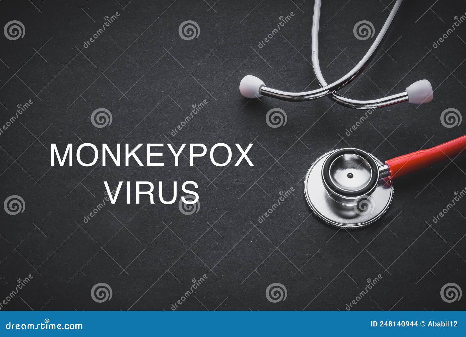 monkeypox virus words written with stethoscope on black background.