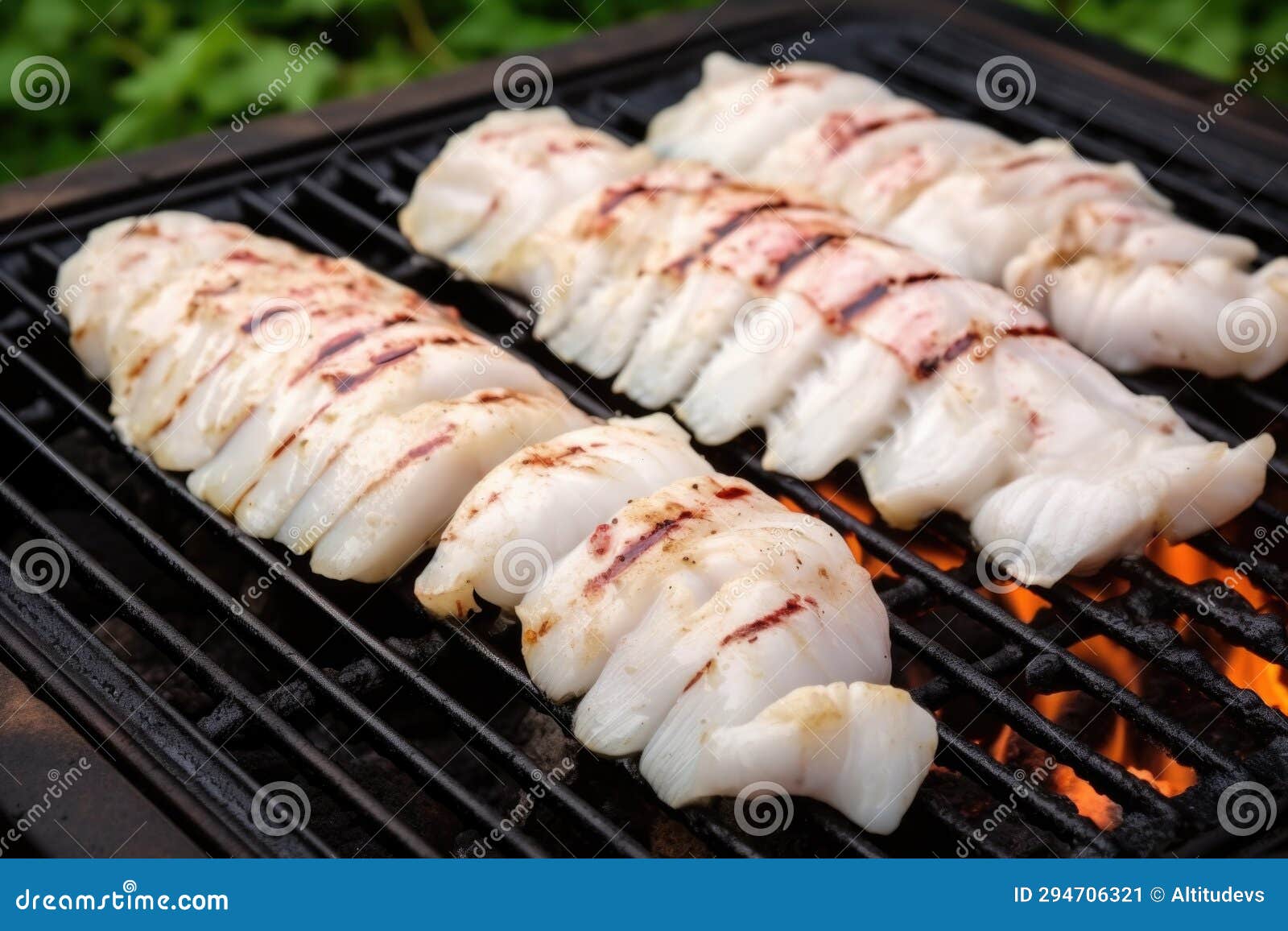 Monkfish Tail Fillets with Barbecue Marks on a Grill Stock Image
