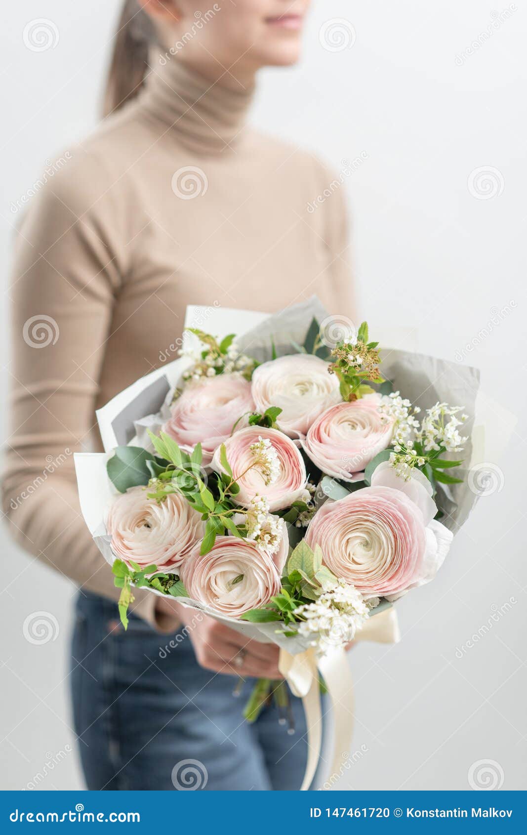 Mono bouquet of roses. Delicate bouquet of mixed flowers in womans hands. the work of the florist at a flower shop. Delicate bouquet of mixed flowers in womans hands. the work of the florist at a flower shop. Delicate Pastel color. Fresh cut flower