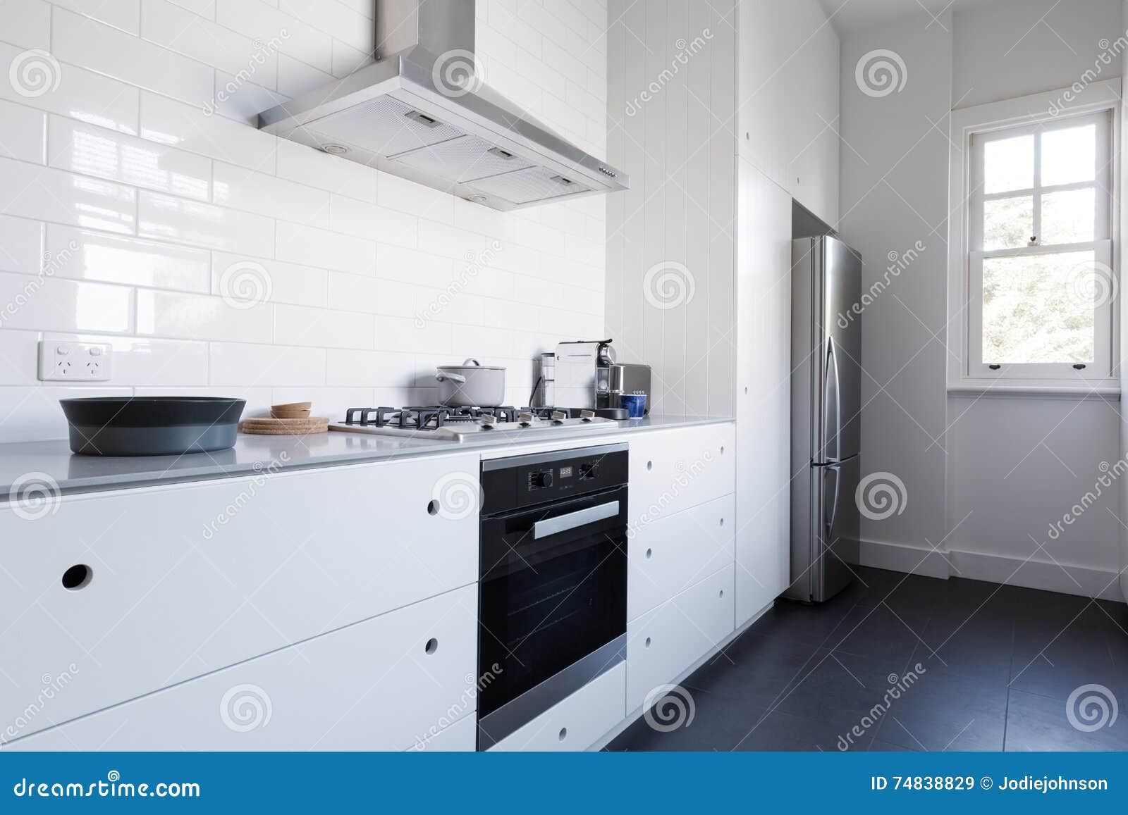 monochrome clean white kitchen benchtop with appliances