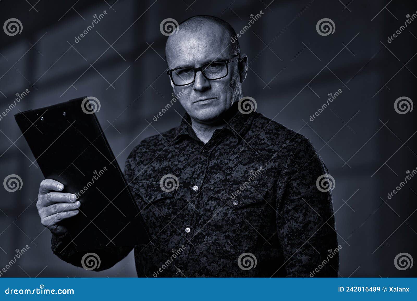 monochrome of a businessman with a clipboard