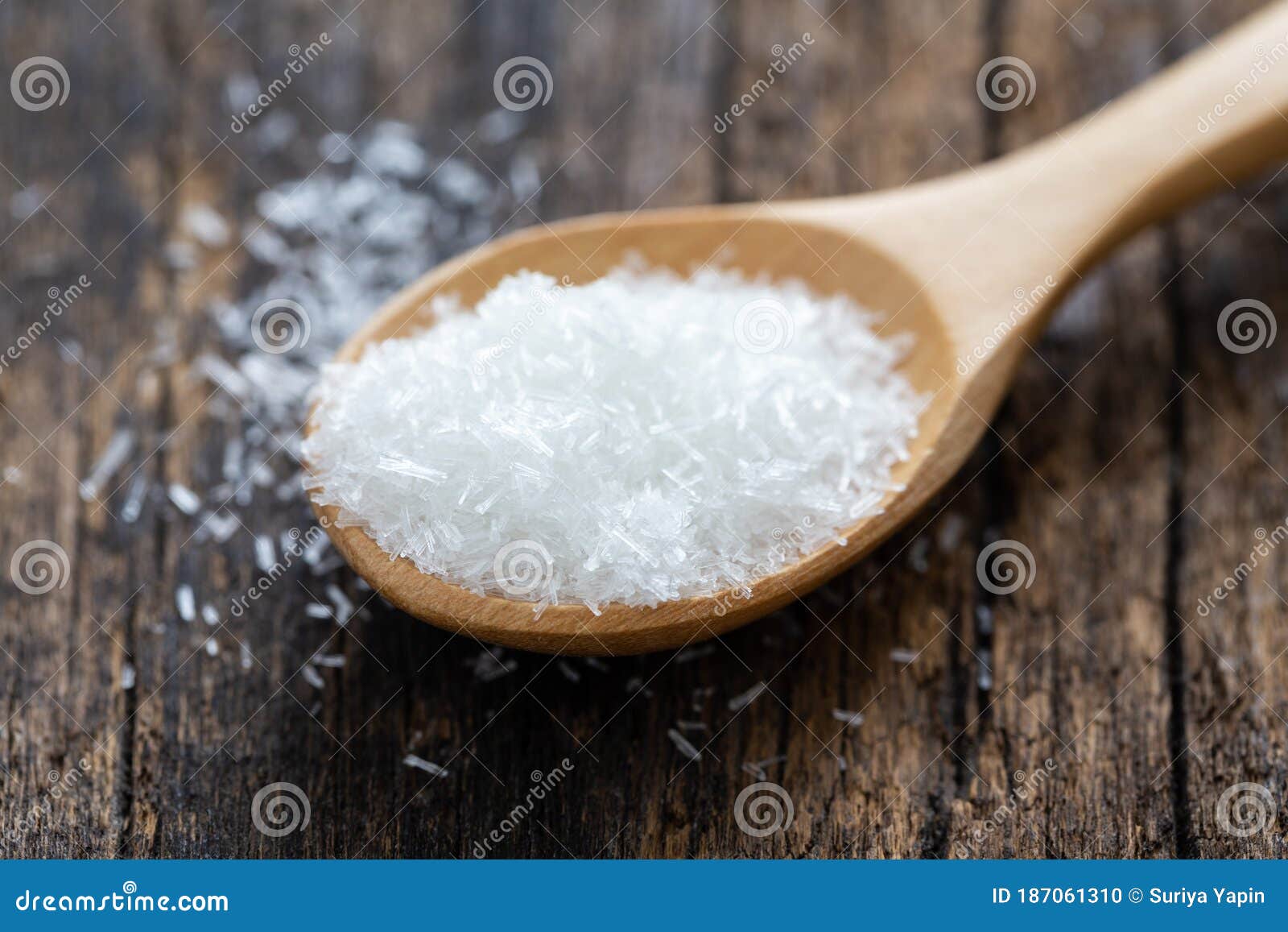 monosodium glutamate, msg on a wooden spoon